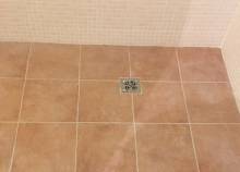 Chantier, carrelage sol de la douche à l'italienne avec grille de vidage à Argenteuil (95)